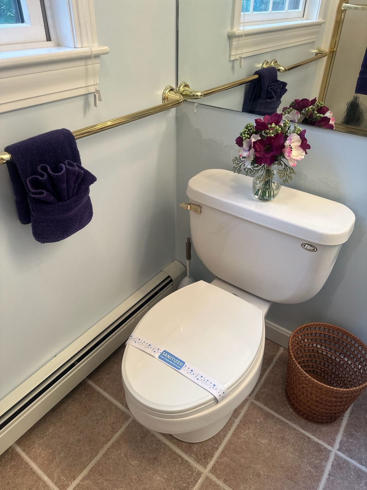 A finished bathroom with clean fixtures and mirror
