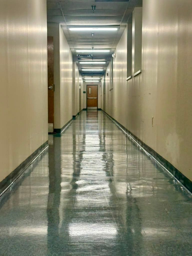 A polished corridor floor inside an office building