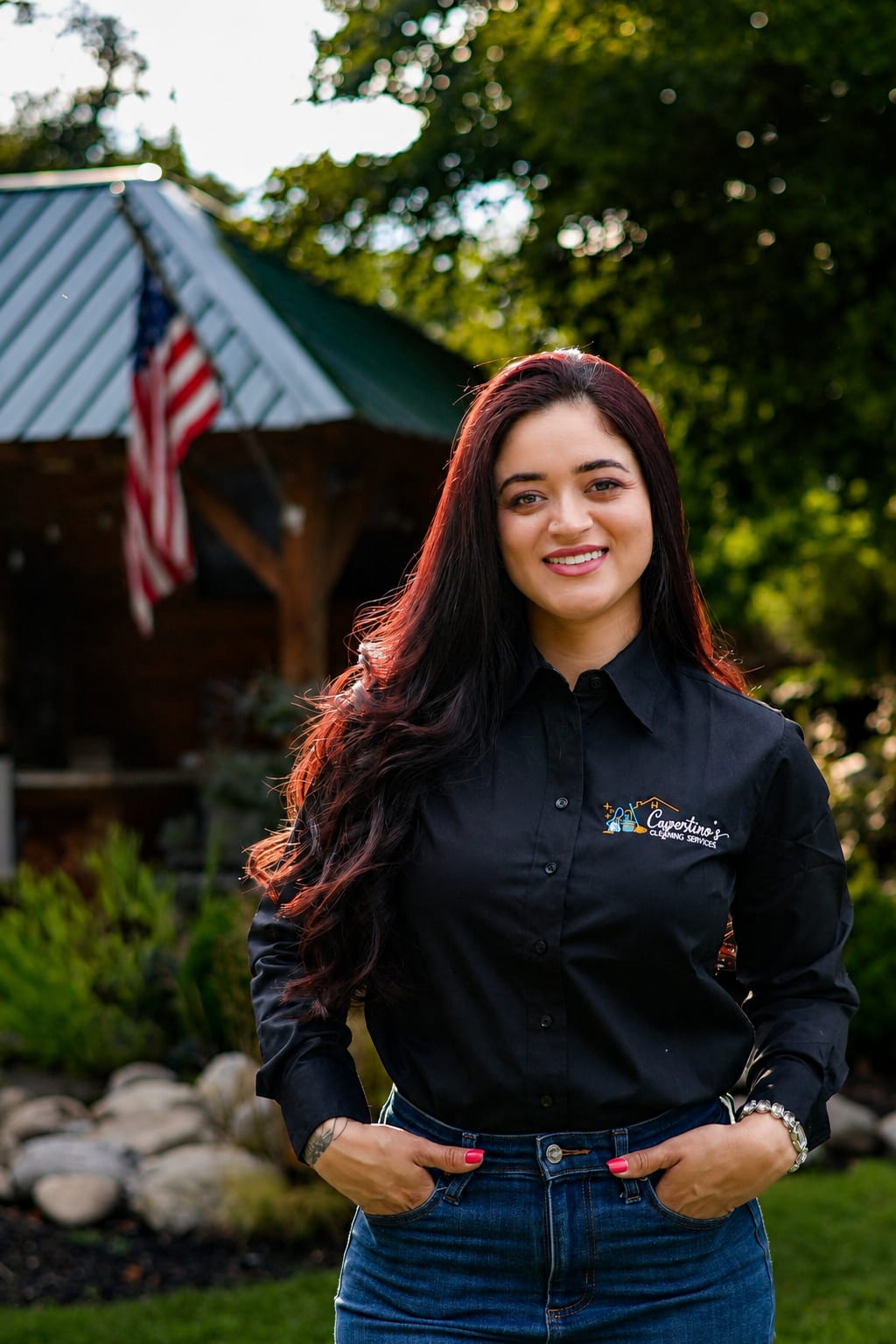 Karolayne Cupertino, founder and CEO of Cupertino's Cleaning Services, in a branded shirt